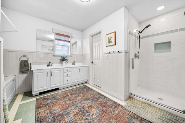 bathroom with walk in shower and vanity