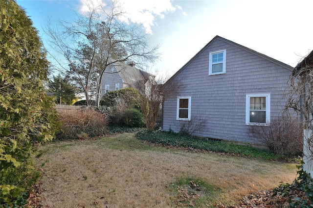 view of home's exterior featuring a lawn