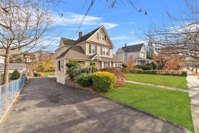 view of side of home featuring a yard