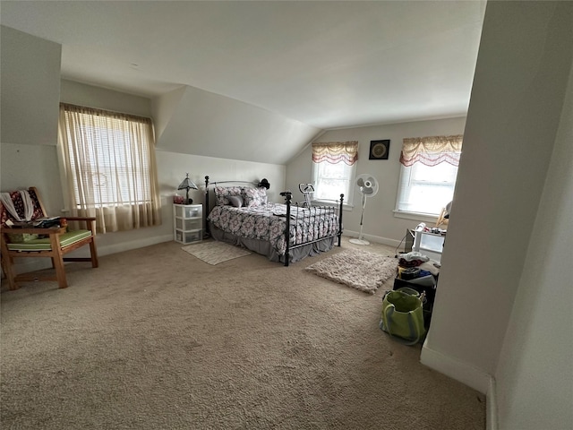 carpeted bedroom featuring vaulted ceiling