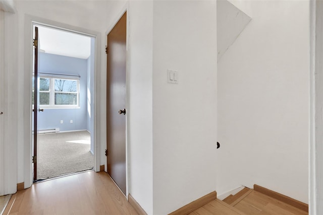 hallway featuring light hardwood / wood-style floors and a baseboard radiator