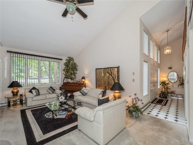 living room with tile patterned floors, ceiling fan with notable chandelier, high vaulted ceiling, and a baseboard heating unit