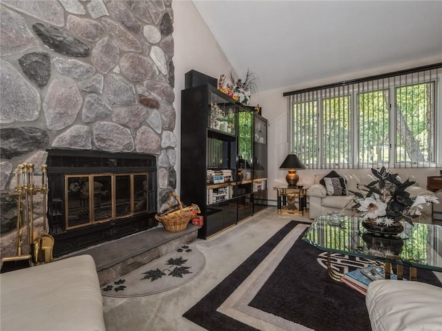 living room featuring a fireplace and high vaulted ceiling