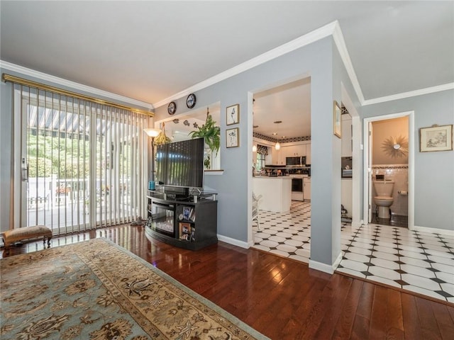 bedroom featuring wood-type flooring, ensuite bathroom, crown molding, and access to outside