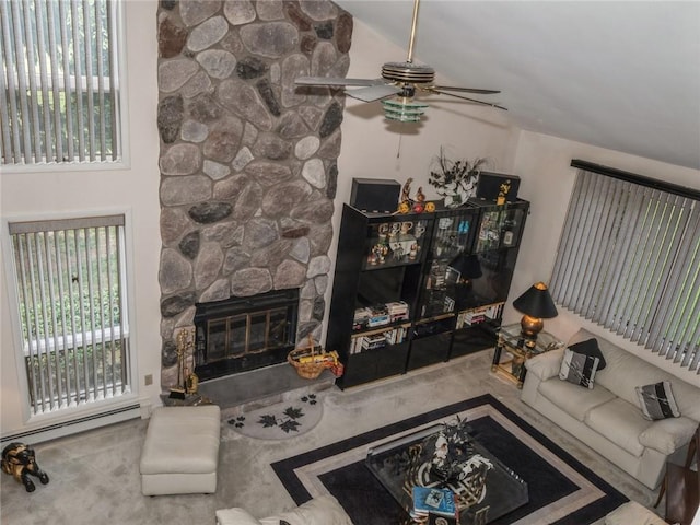 living room with a fireplace, baseboard heating, vaulted ceiling, and ceiling fan