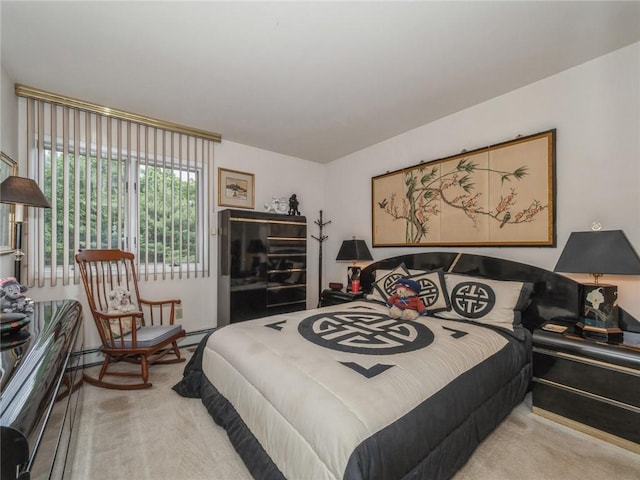 bedroom featuring light carpet and a baseboard radiator