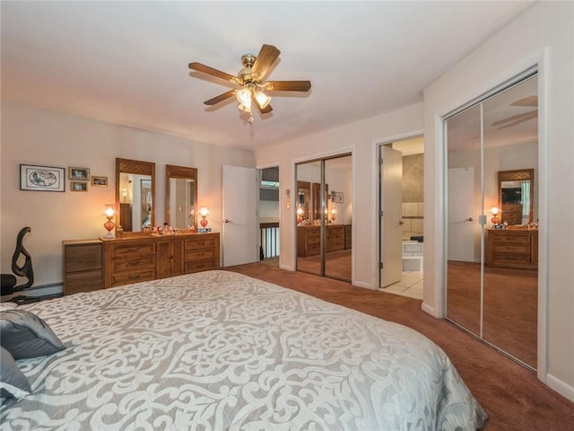 bedroom featuring two closets, ceiling fan, baseboard heating, connected bathroom, and light colored carpet