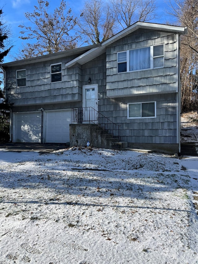 bi-level home featuring a garage