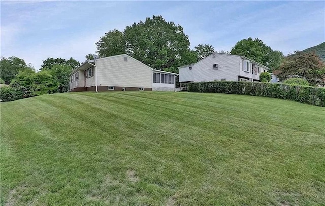 view of yard with a sunroom