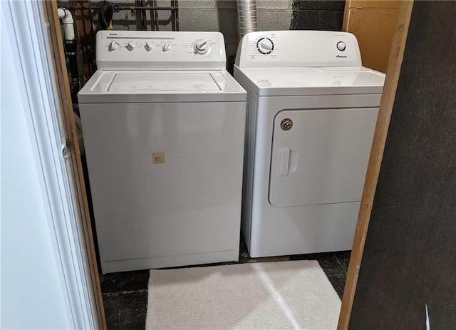 laundry area featuring washing machine and clothes dryer