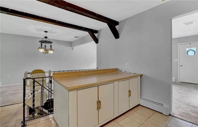 kitchen with light carpet, beam ceiling, decorative light fixtures, a baseboard radiator, and a chandelier