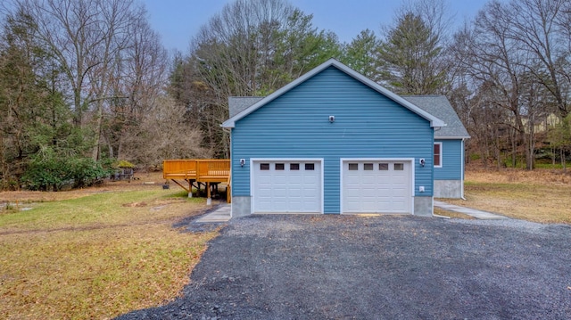 garage featuring a yard