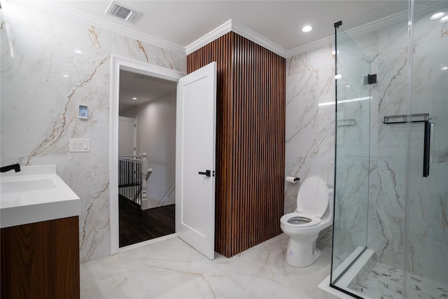 bathroom featuring crown molding, toilet, a shower with door, vanity, and tile walls