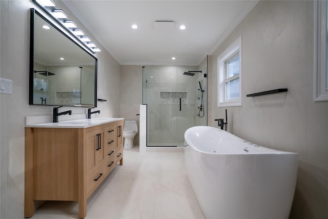 full bathroom featuring vanity, toilet, crown molding, and independent shower and bath