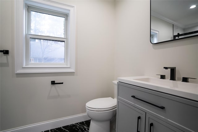 bathroom with vanity and toilet