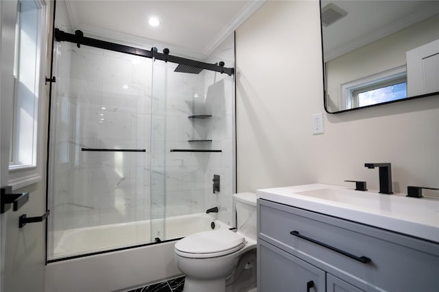 full bathroom featuring vanity, crown molding, toilet, enclosed tub / shower combo, and a wealth of natural light