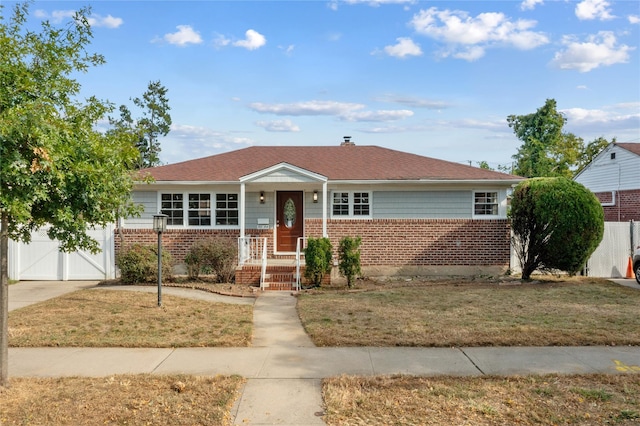 single story home with a front yard