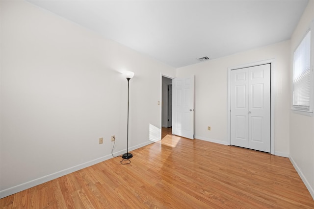 unfurnished bedroom with light hardwood / wood-style floors