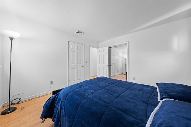 bedroom with wood-type flooring