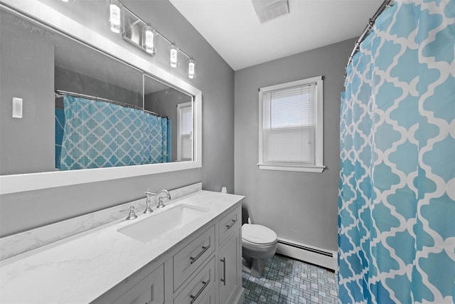 bathroom with vanity, toilet, and baseboard heating