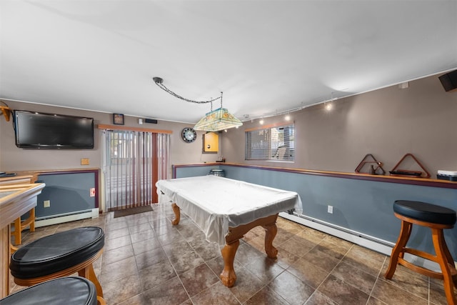 playroom with a wealth of natural light, track lighting, pool table, and a baseboard heating unit