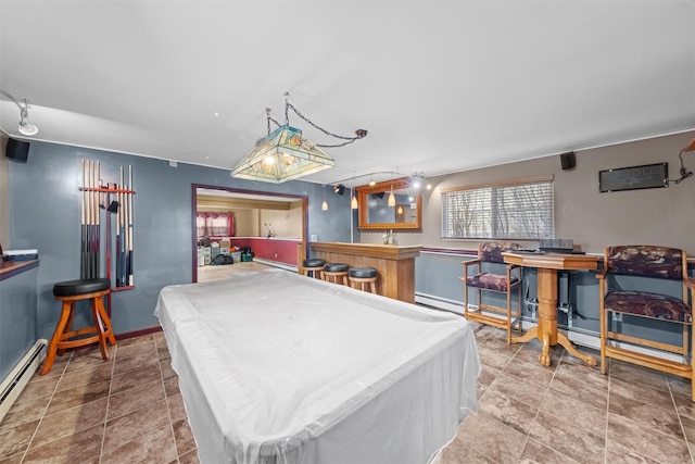 game room featuring indoor bar, a baseboard radiator, and pool table