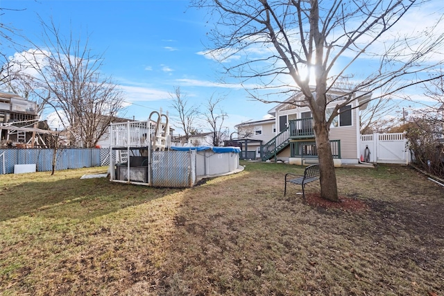 view of yard with a pool side deck