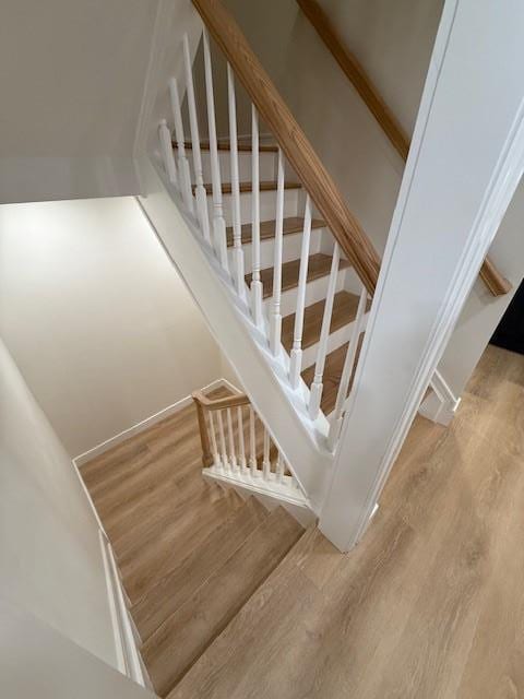 stairway featuring hardwood / wood-style flooring