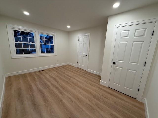 unfurnished room featuring light wood-type flooring