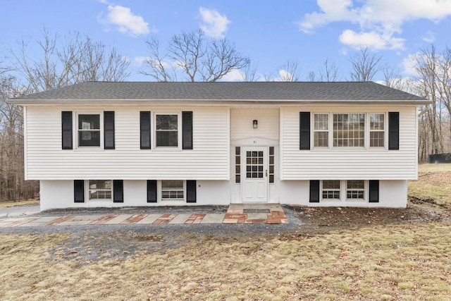 bi-level home with a front yard