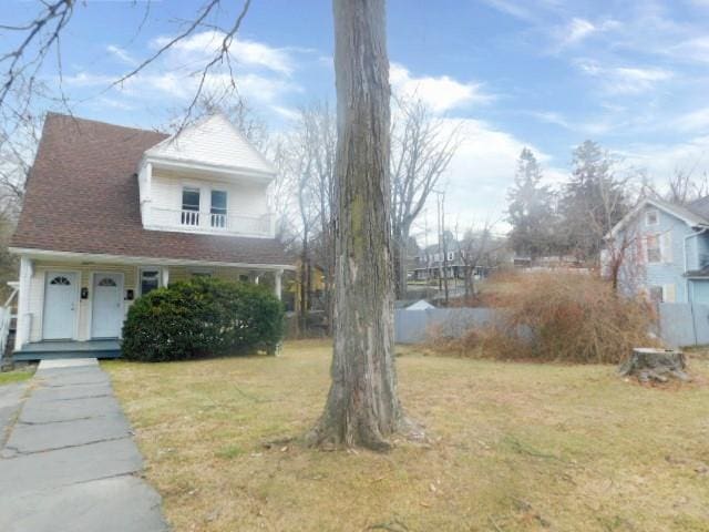 view of side of property featuring a yard