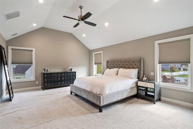 bedroom with carpet floors, vaulted ceiling, and ceiling fan