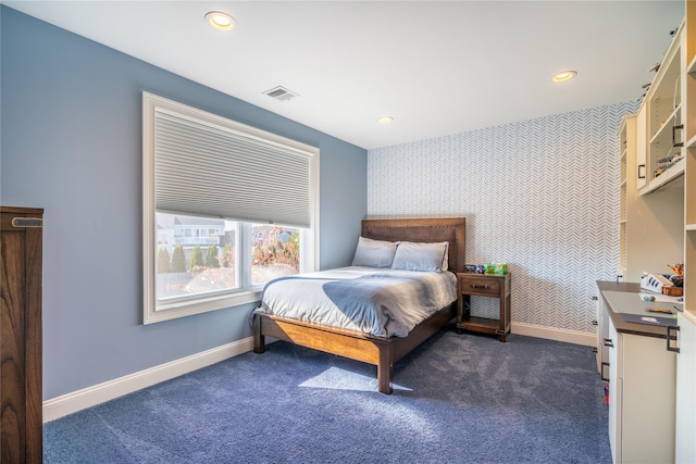 bedroom featuring dark colored carpet