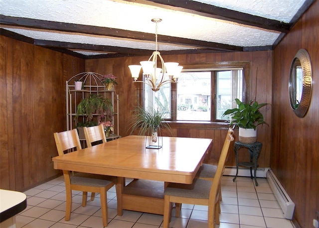 tiled dining area featuring beam ceiling, wooden walls, an inviting chandelier, and a baseboard heating unit