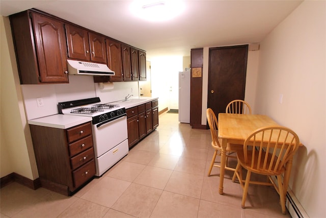 kitchen with baseboard heating, dark brown cabinets, white appliances, and sink