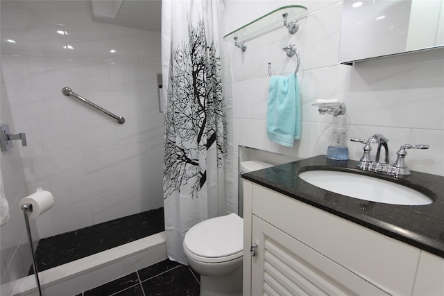 bathroom featuring walk in shower, tile patterned floors, toilet, vanity, and tile walls