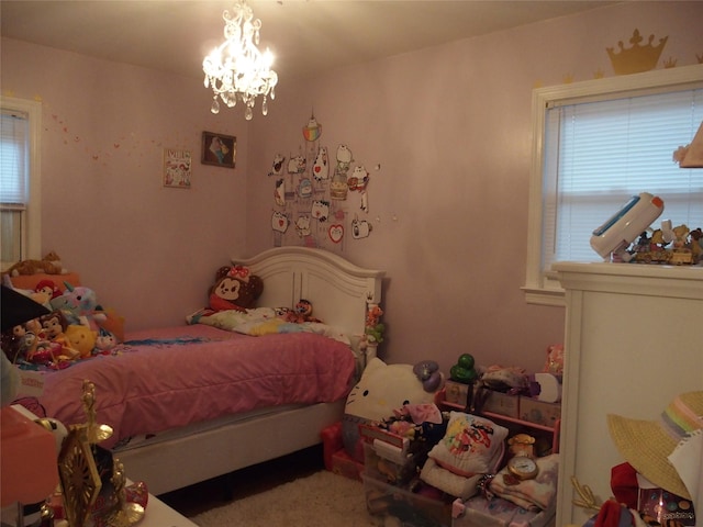 bedroom featuring an inviting chandelier