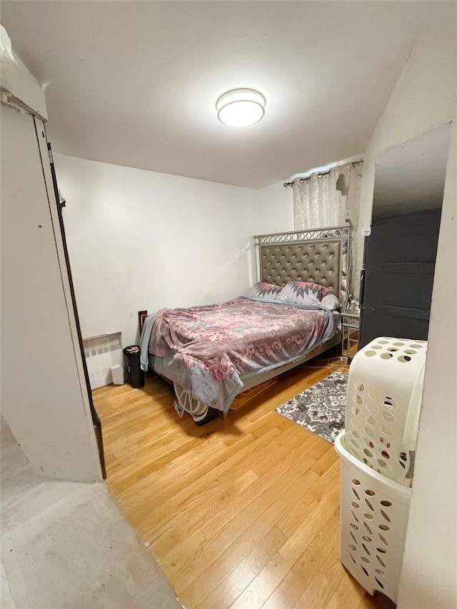 bedroom with hardwood / wood-style floors