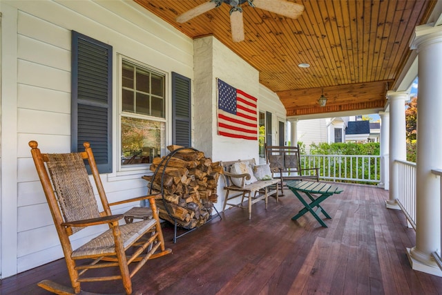 deck featuring covered porch and ceiling fan