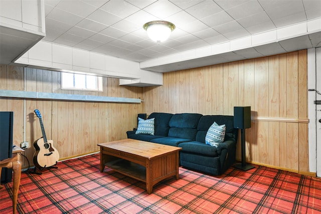 living room with wood walls