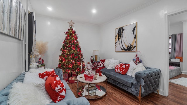 living room with hardwood / wood-style floors and ornamental molding