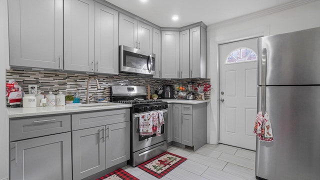 2354 Waterbury Ave, Bronx, NY 10462 - kitchen featuring stainless steel appliances, gray cabinets, light countertops, decorative backsplash, and recessed lighting