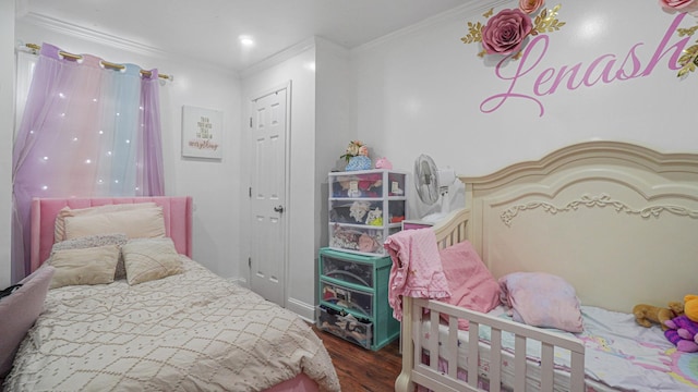 bedroom with hardwood / wood-style floors and ornamental molding