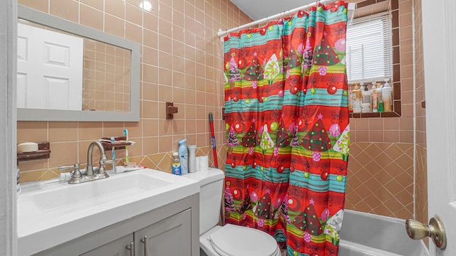 full bathroom featuring vanity, toilet, shower / bathtub combination with curtain, and tile walls