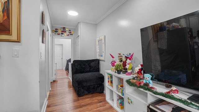 hallway featuring light hardwood / wood-style flooring and ornamental molding