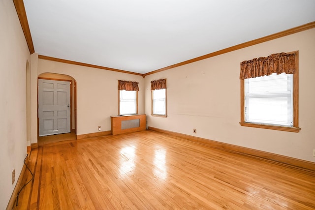 unfurnished room with light hardwood / wood-style flooring and ornamental molding