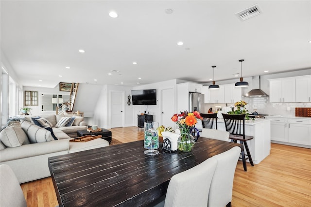 dining room with light wood-type flooring