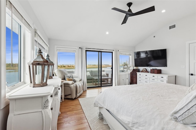 bedroom featuring access to exterior, ceiling fan, light hardwood / wood-style flooring, lofted ceiling, and multiple windows