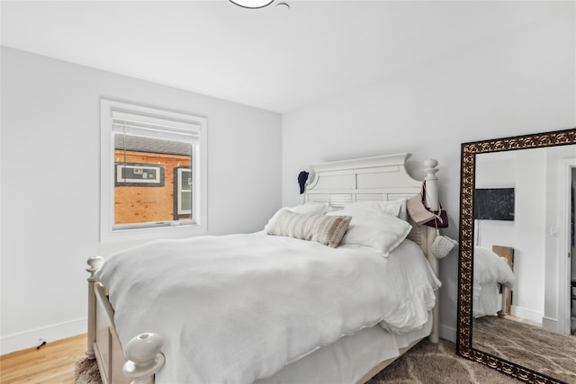 bedroom featuring wood-type flooring