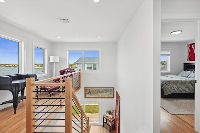 stairway with hardwood / wood-style flooring